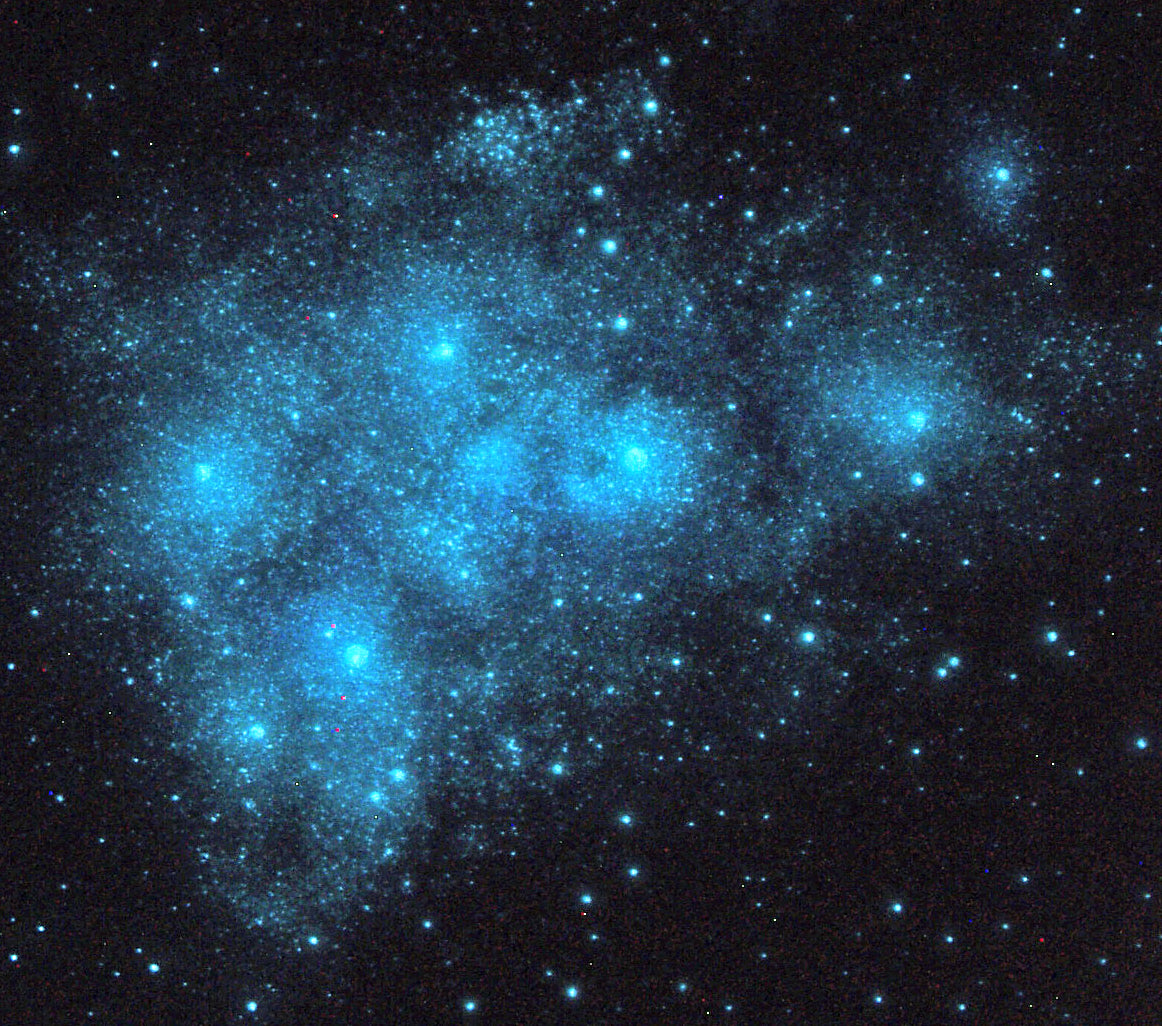 pleiades glow in the dark painting on a peel and stick adhesive mural. Sticks to the bedroom wall or ceiling, the stars are glowing blue.