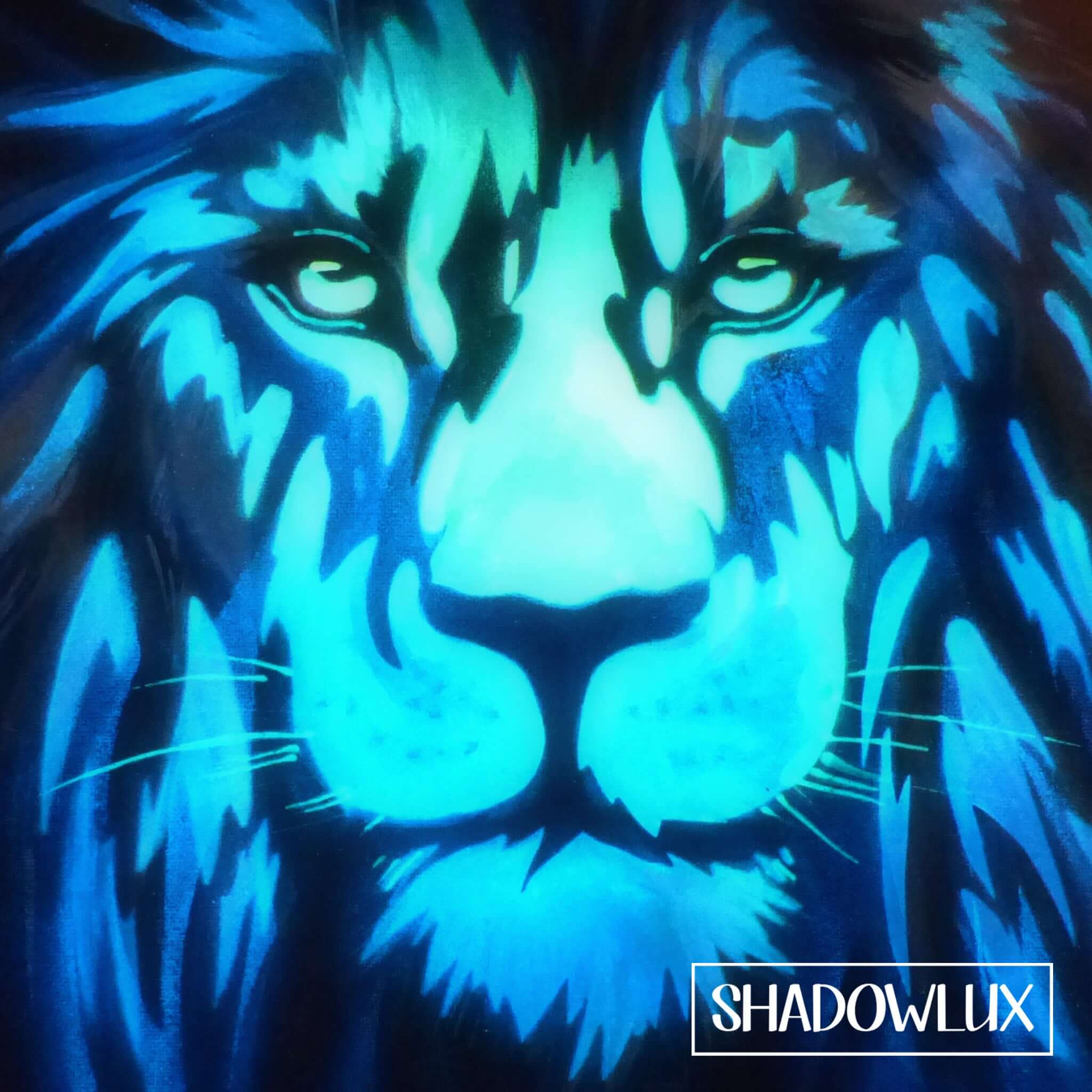 Lion face artwork showing glow in the dark details visible in low light at night