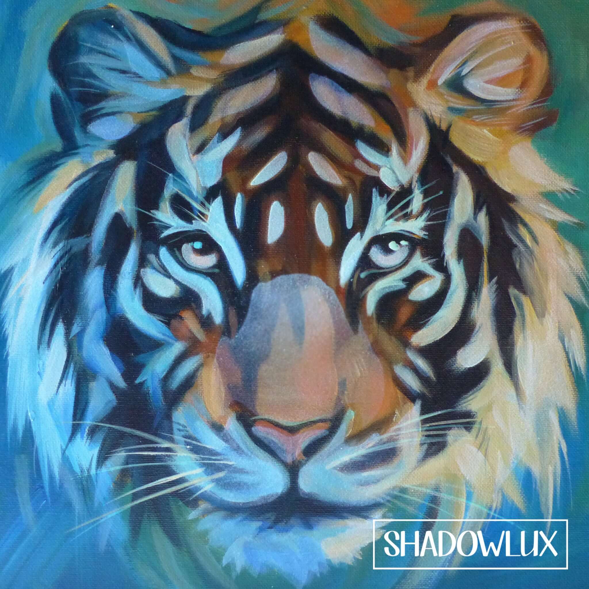 Close-up of a tiger’s face illuminated by subtle glow pigments, visible in low light.