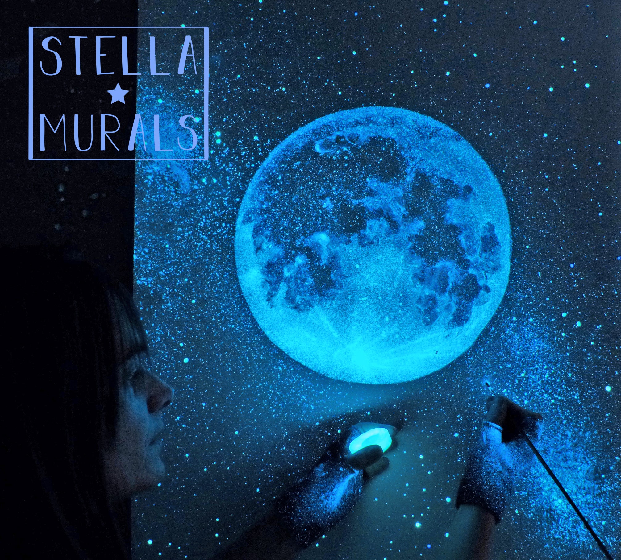 glow in the dark artist esther at stella murals painting moon mural