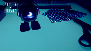 Emo the desktop robot and glow stars, saying goodnight