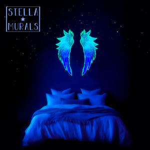 glow in the dark angel wings in a night time bedroom, fantasy photoluminescent decals to turn your bedroom into a dreamy starry realm. 