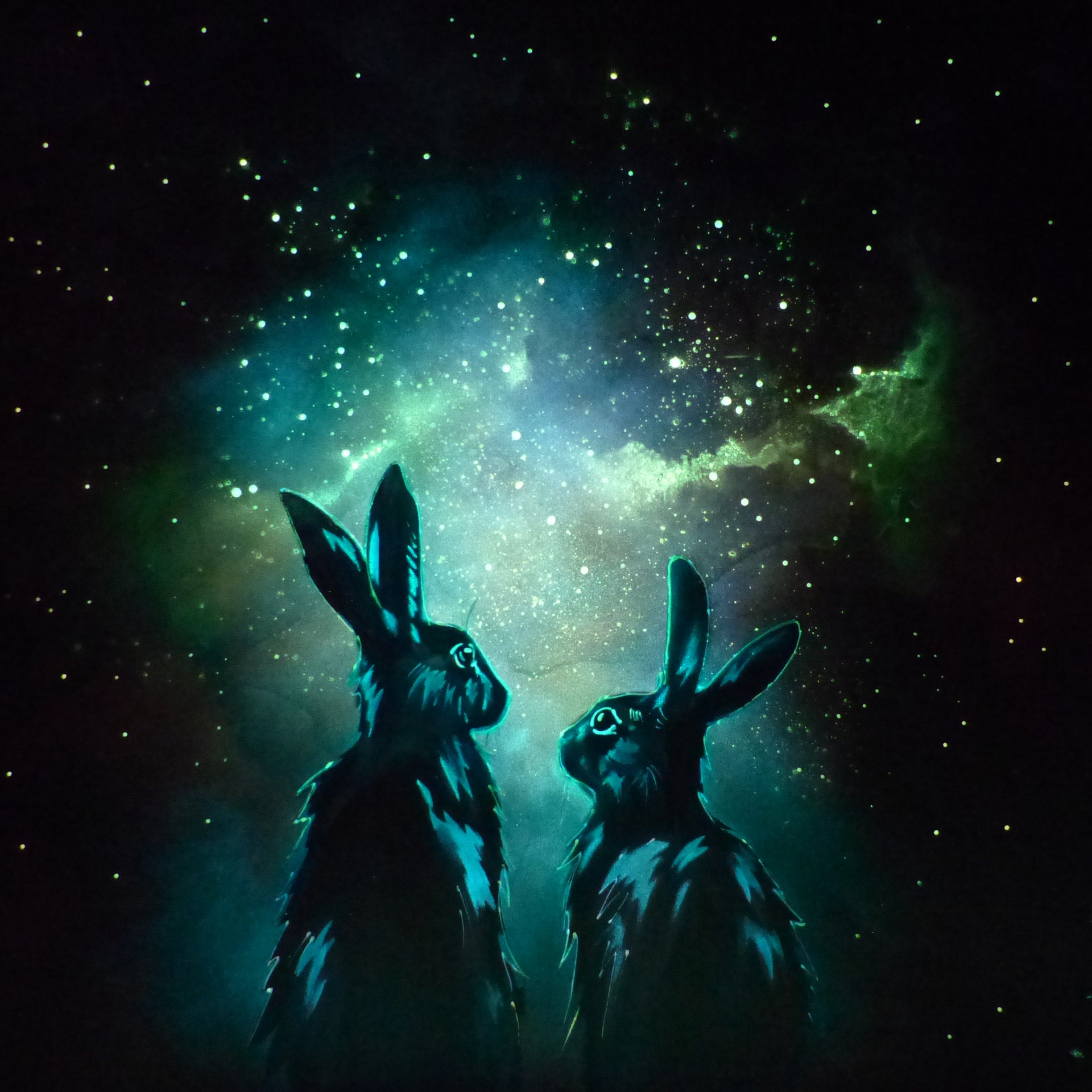 Two glow in the dark  rabbits silhouetted against a starry night sky with a nebula.