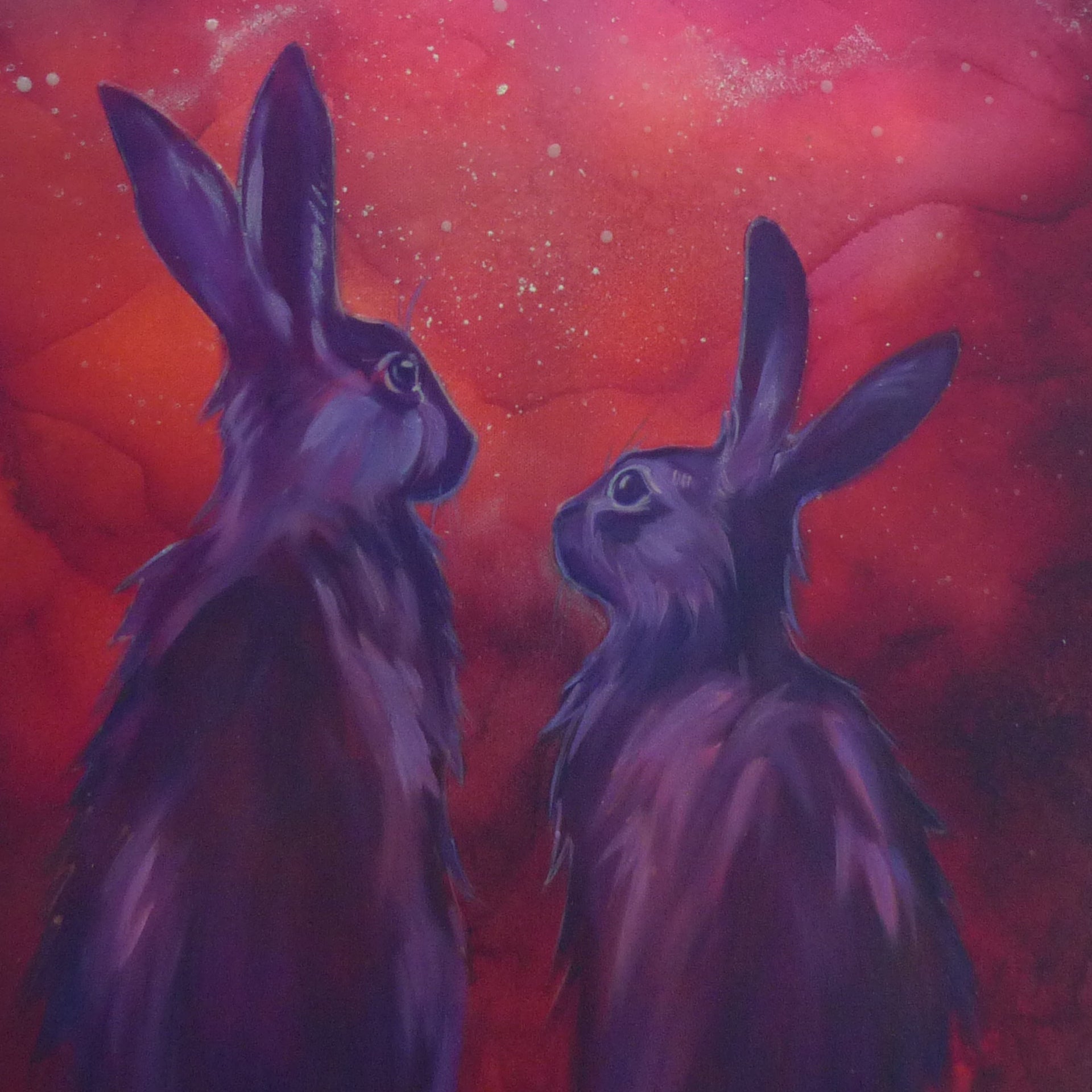 Two purple rabbits against a red and orange cosmic glowing sky background