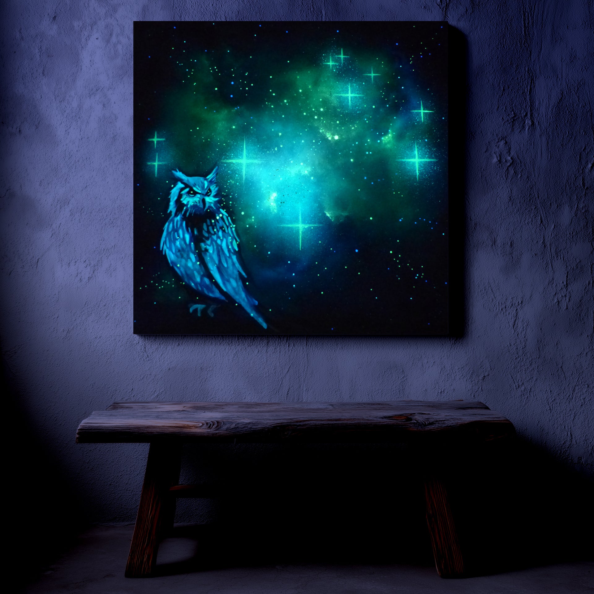 glow in the dark artwork of a owl with a glowing green and blue celestial background on a dark wall.