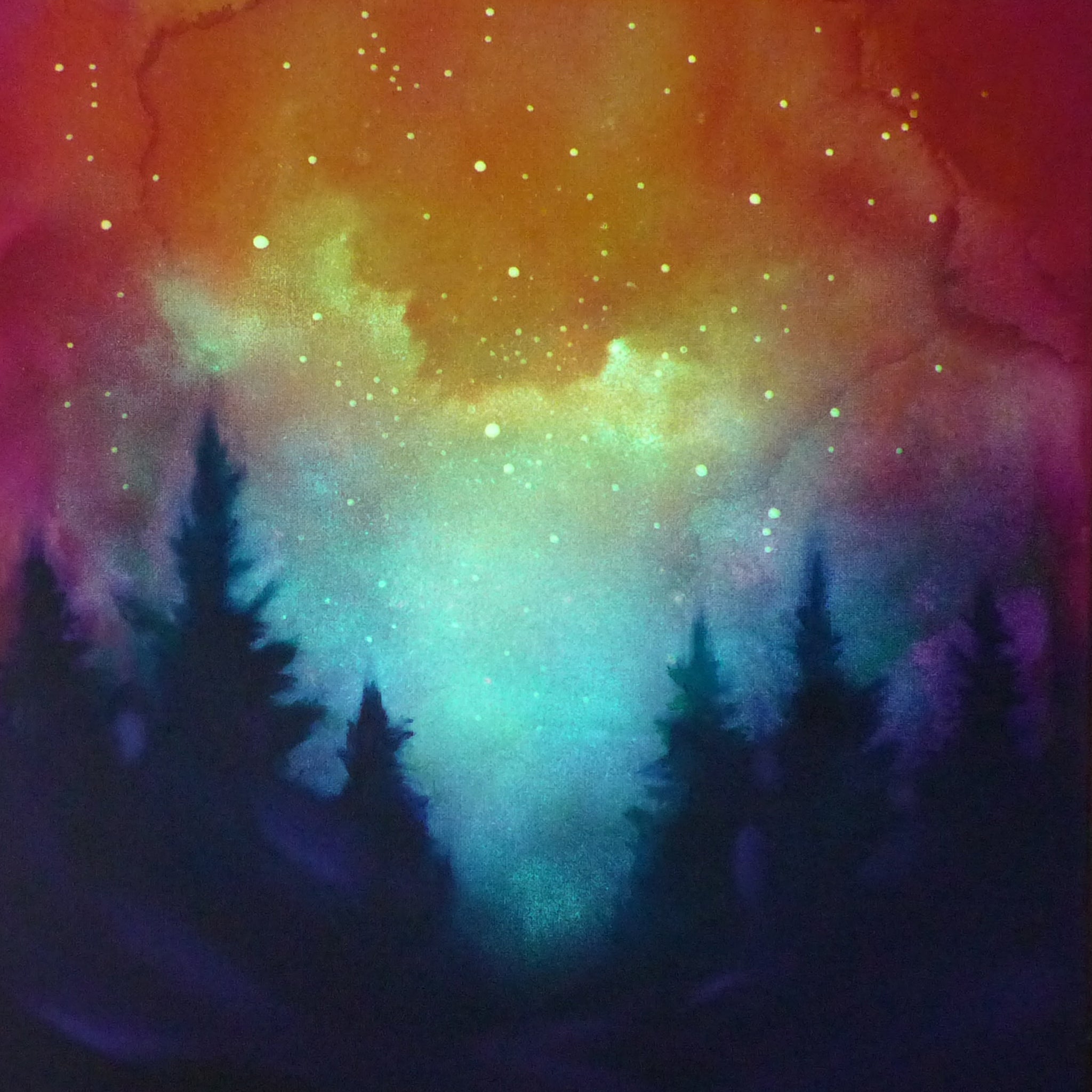 Colorful glow in the dark  nebula with silhouettes of trees