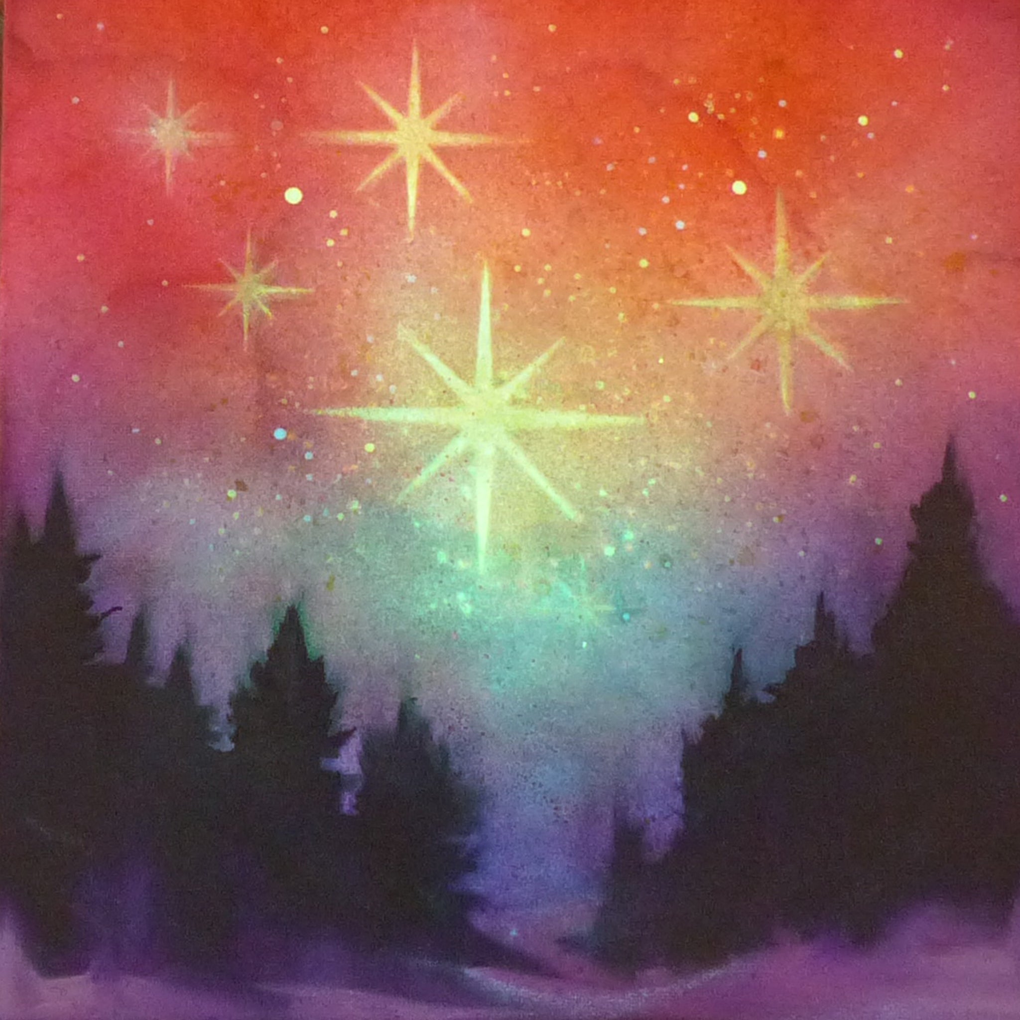 Colorful glow in the dark starry night sky with silhouette trees