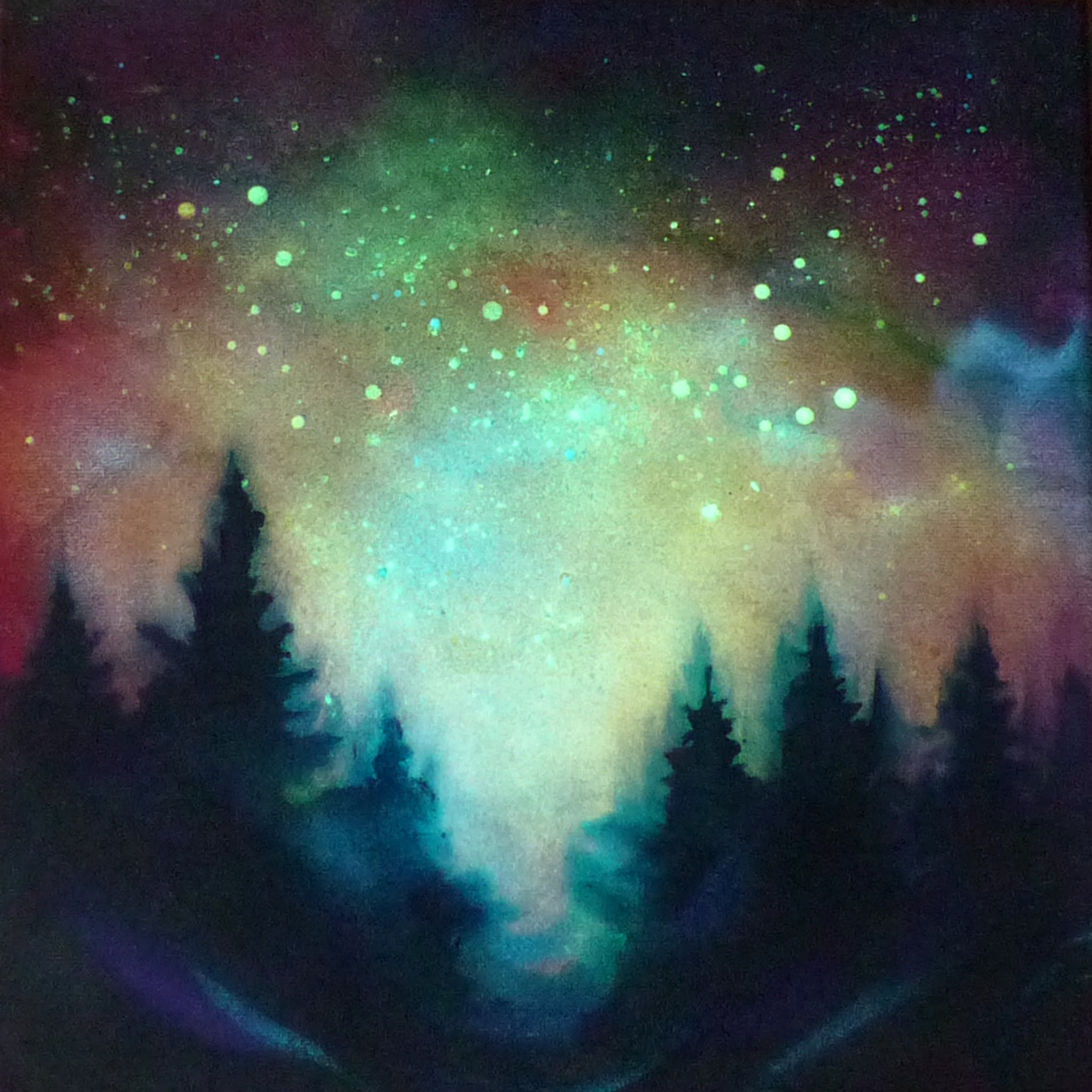 Colorful glow in the dark nebula with silhouette of trees in the foreground