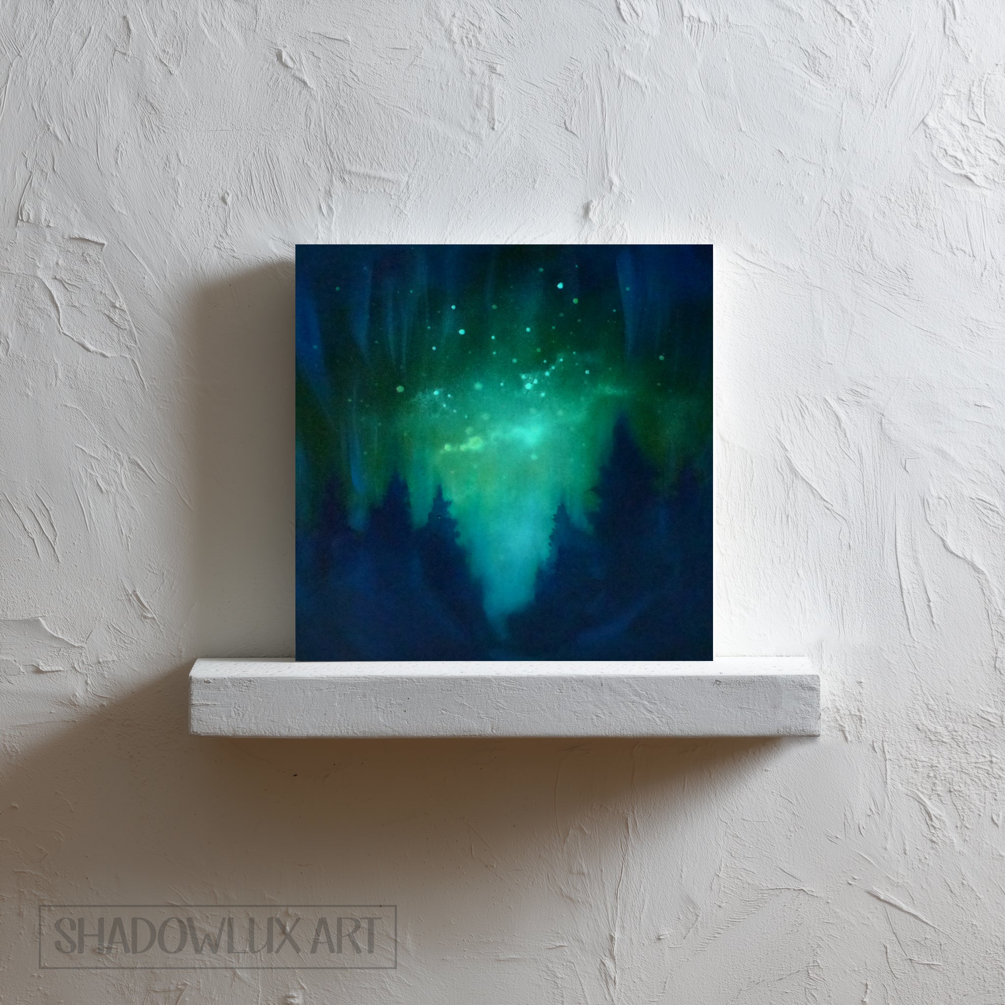 glow in the dark aurora artwork of a celestial scene with green and blue hues on a white wall.