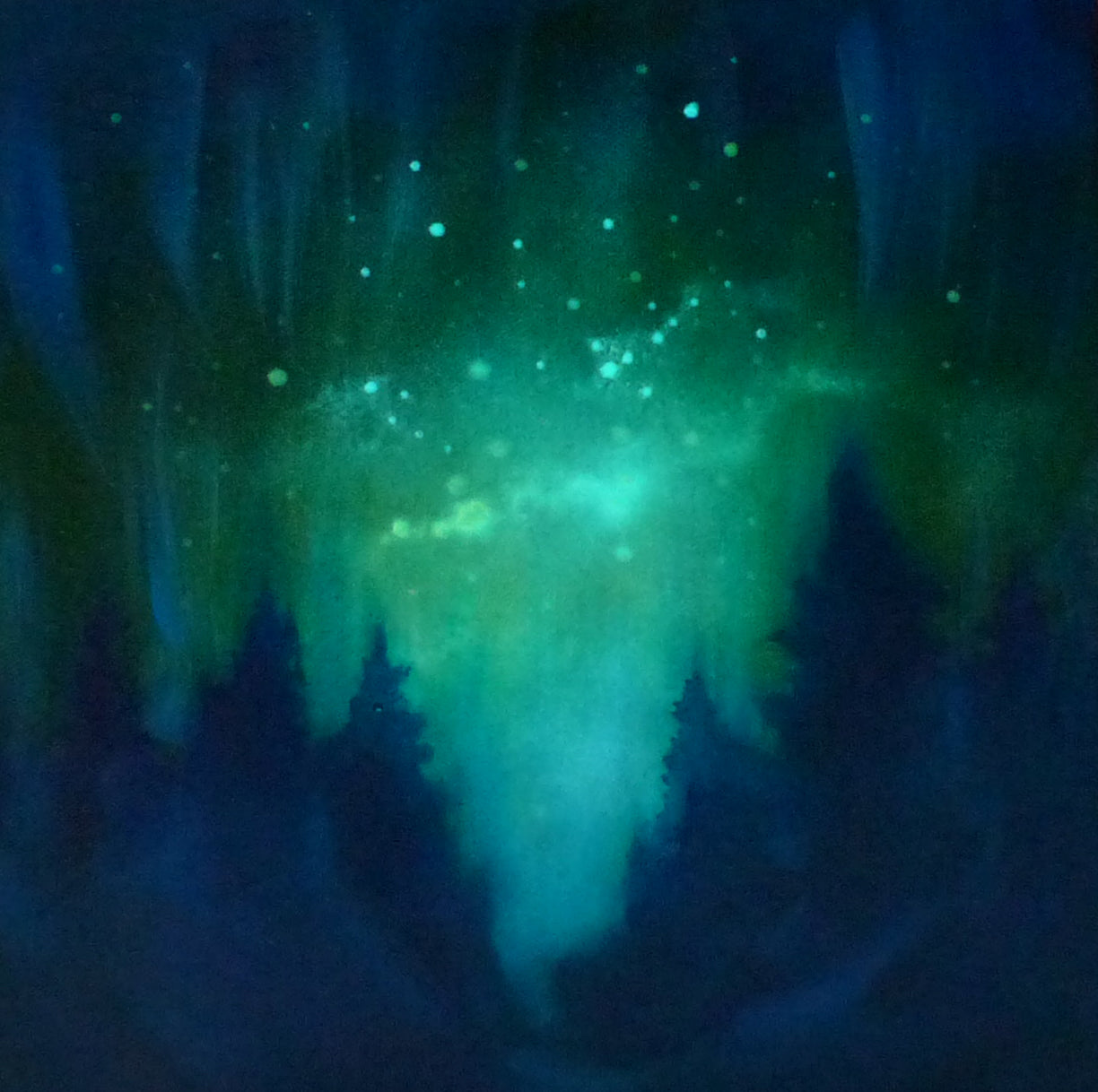 glow in the dark Aurora borealis over a forest with silhouetted trees