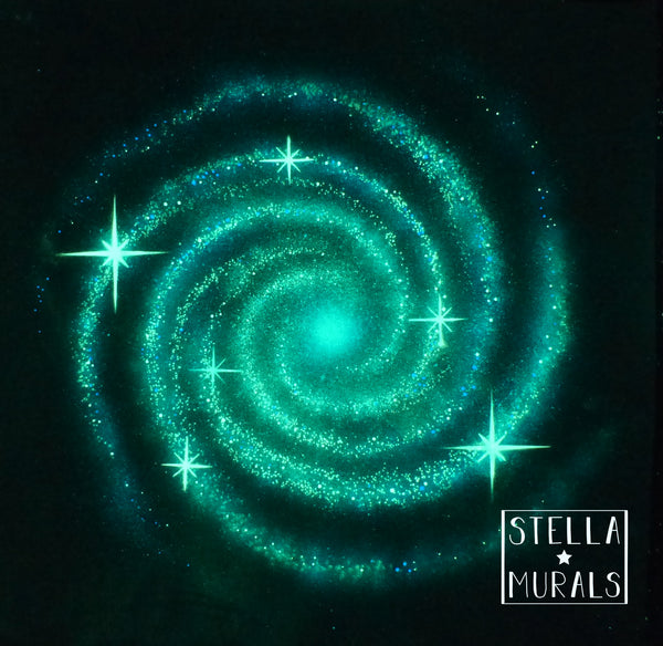 A luminous green and blue spiral galaxy whirlpool glow-in-the-dark adhesive mural for bedroom walls.